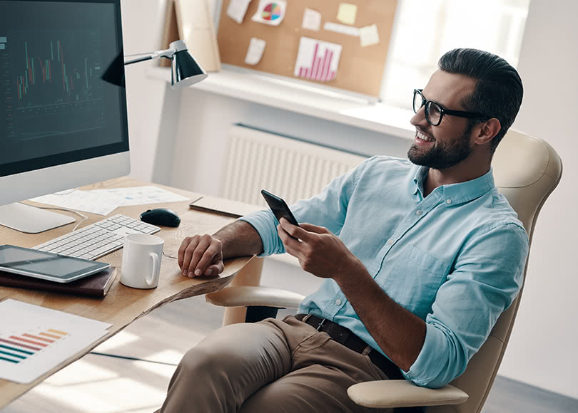 man-phone-desk-office-810x580