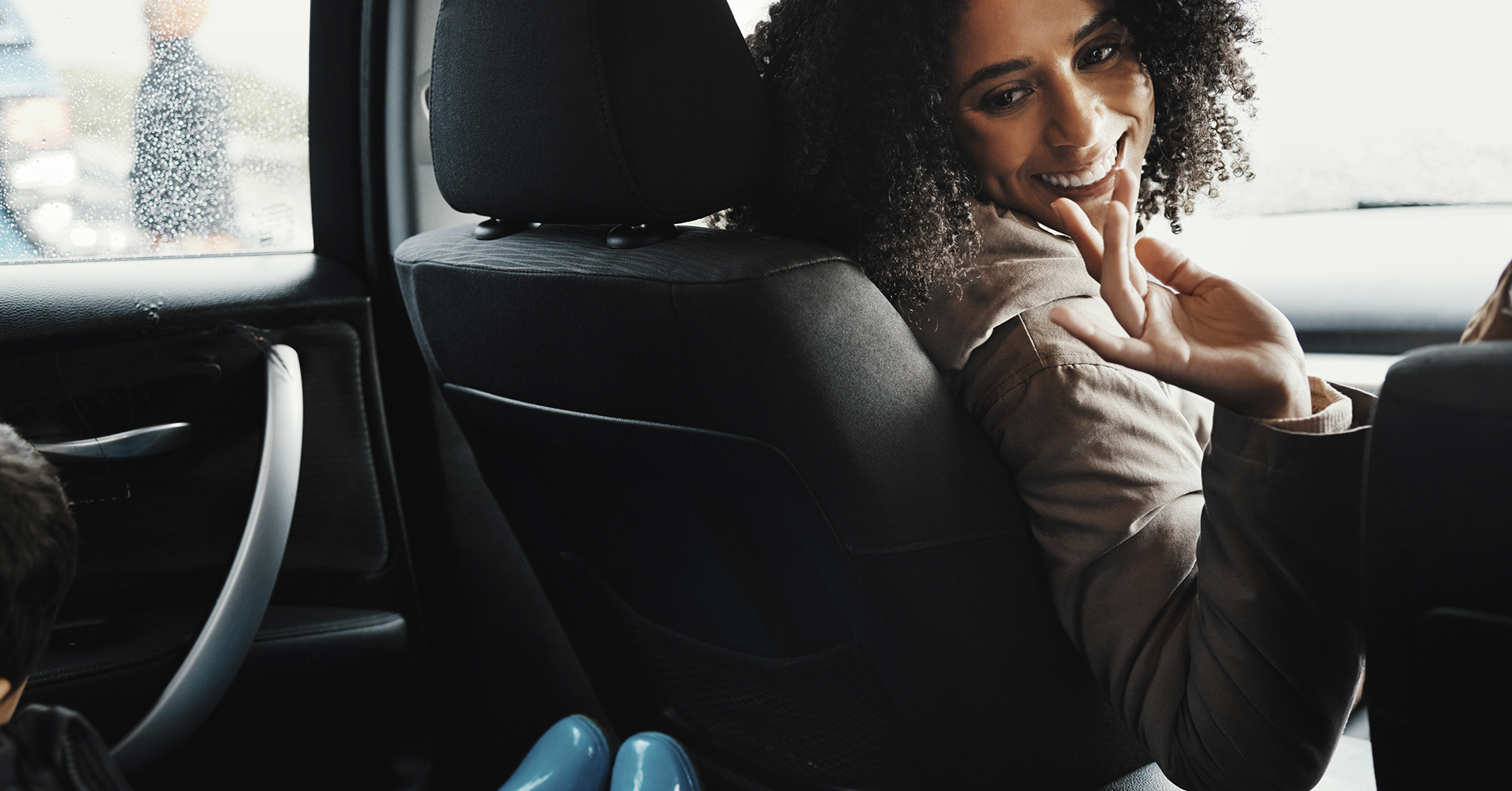 Women in the car without having to worry about a ticket enjoying a conversation with her son